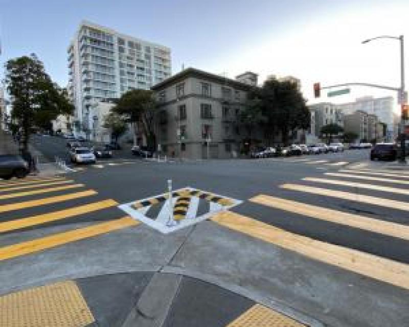 yellow crosswalks and raised mountable curbs on the corner at franklin street 