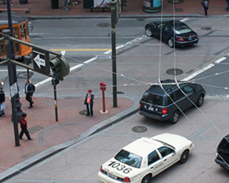 Market Street with streetcar, autos and pedestrians