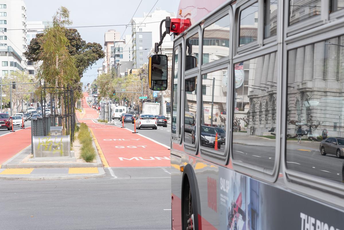 Closeup of a 49 Van Ness bus as it approaches a red, transit-only lane on Van Ness Avenue. Closeup of a 49 Van Ness bus as it approaches a red, transit-only lane on Van Ness Avenue.