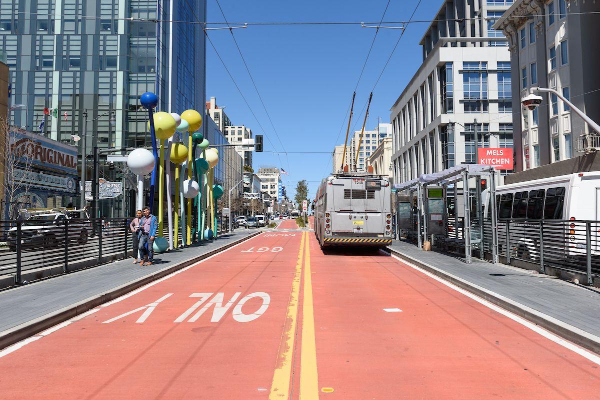 Shot of a 49 Van Ness driving north on Van Ness Avenue using one of the red, transit-only lanes. Shot of a 49 Van Ness driving north on Van Ness Avenue using one of the red, transit-only lanes.