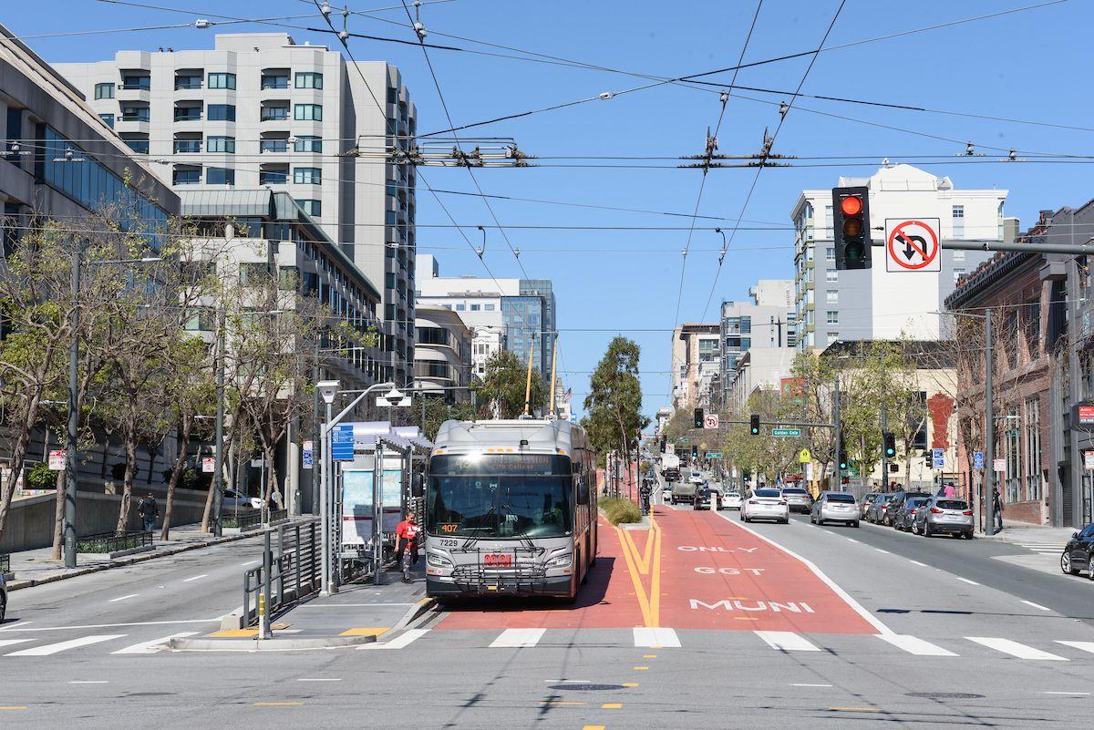 49 Van Ness bus stops at a boarding island on Van Ness Avenue, using one of its red, transit-only lanes. 49 Van Ness bus stops at a boarding island on Van Ness Avenue, using one of its red, transit-only lanes.
