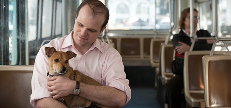 Passenger with his leashed dog